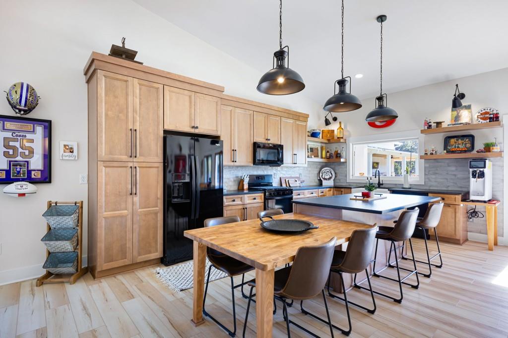 125 Perry Road Rydal, GA 30171 - Photo 89 of 139 a view of a dining room with furniture wooden floor and a chandelier