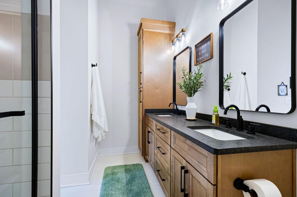 125 Perry Road Rydal, GA 30171 - Photo 99 of 139 a bathroom with a double vanity sink and a mirror