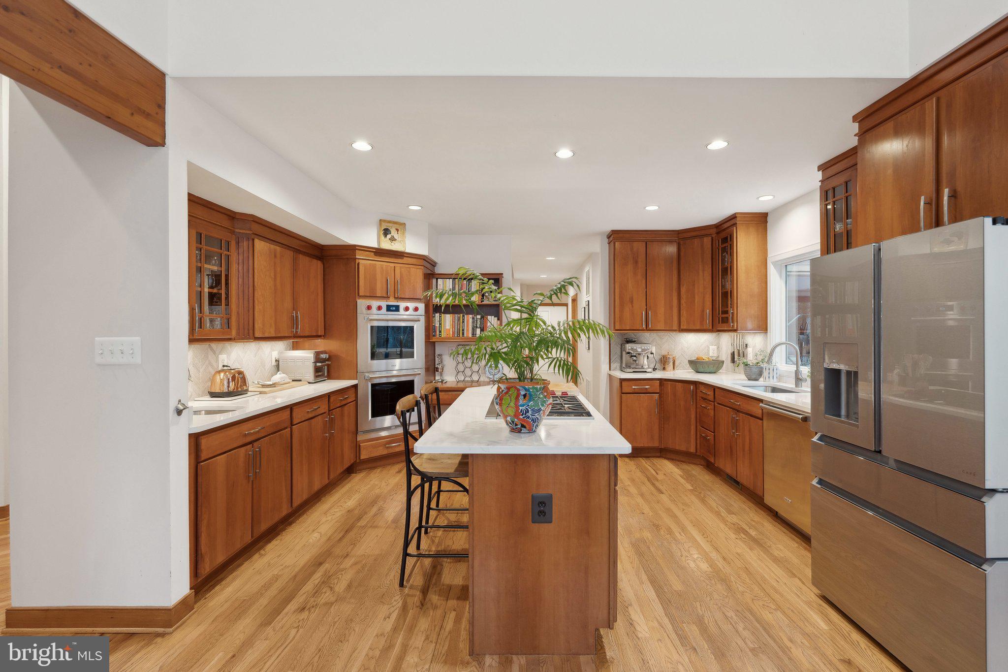 7514 A Evans Ford Road Clifton, VA 20124 - Photo 20 of 50 a kitchen with stainless steel appliances granite countertop a sink stove and refrigerator