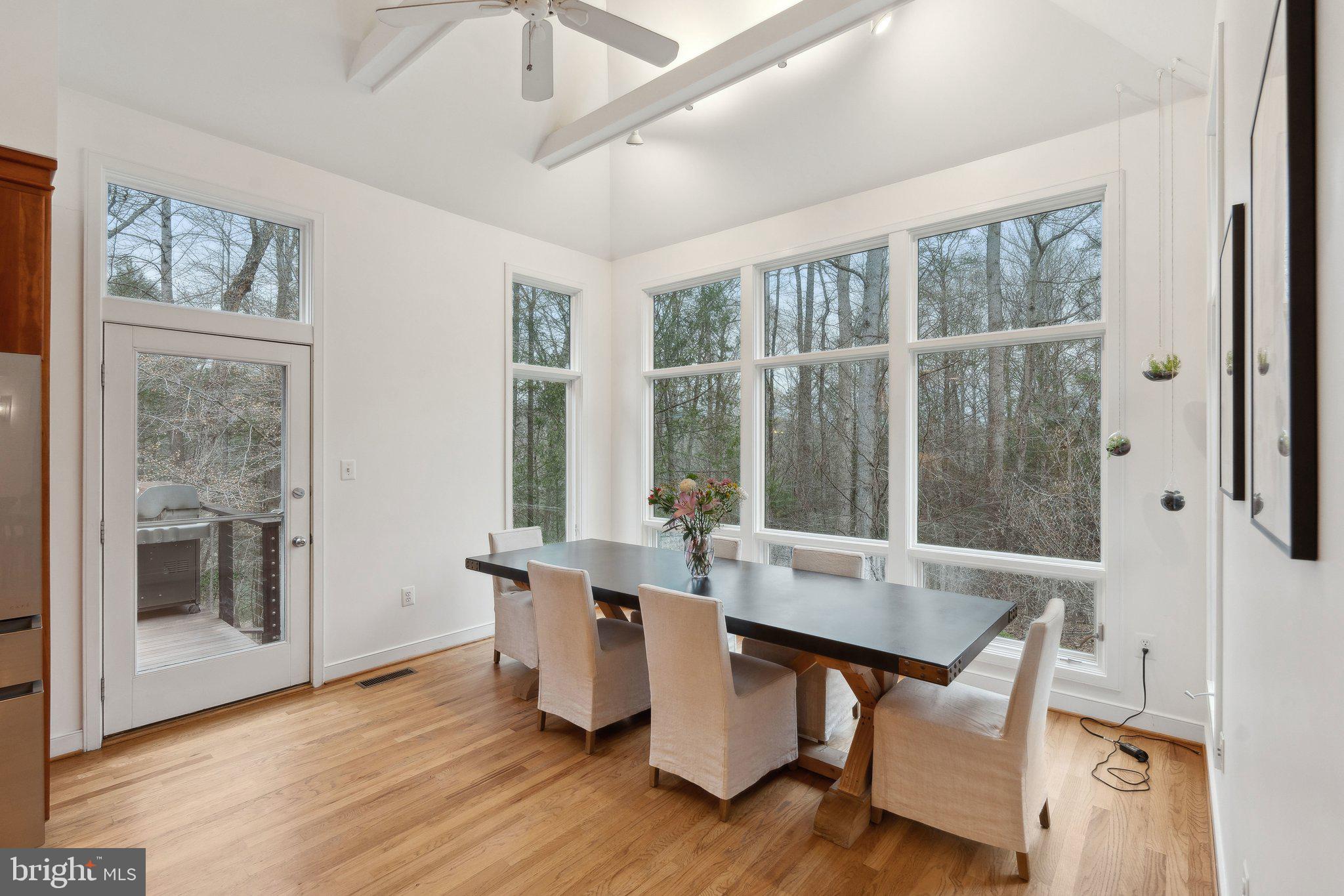 7514 A Evans Ford Road Clifton, VA 20124 - Photo 21 of 50 a view of a dining room with furniture window and wooden floor