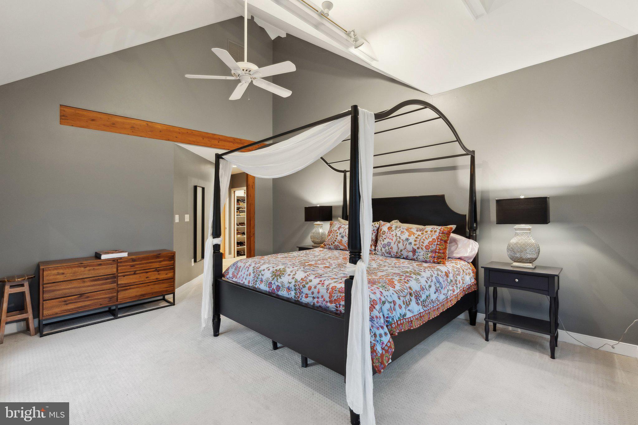 7514 A Evans Ford Road Clifton, VA 20124 - Photo 22 of 50 a bedroom with a bed and a chandelier