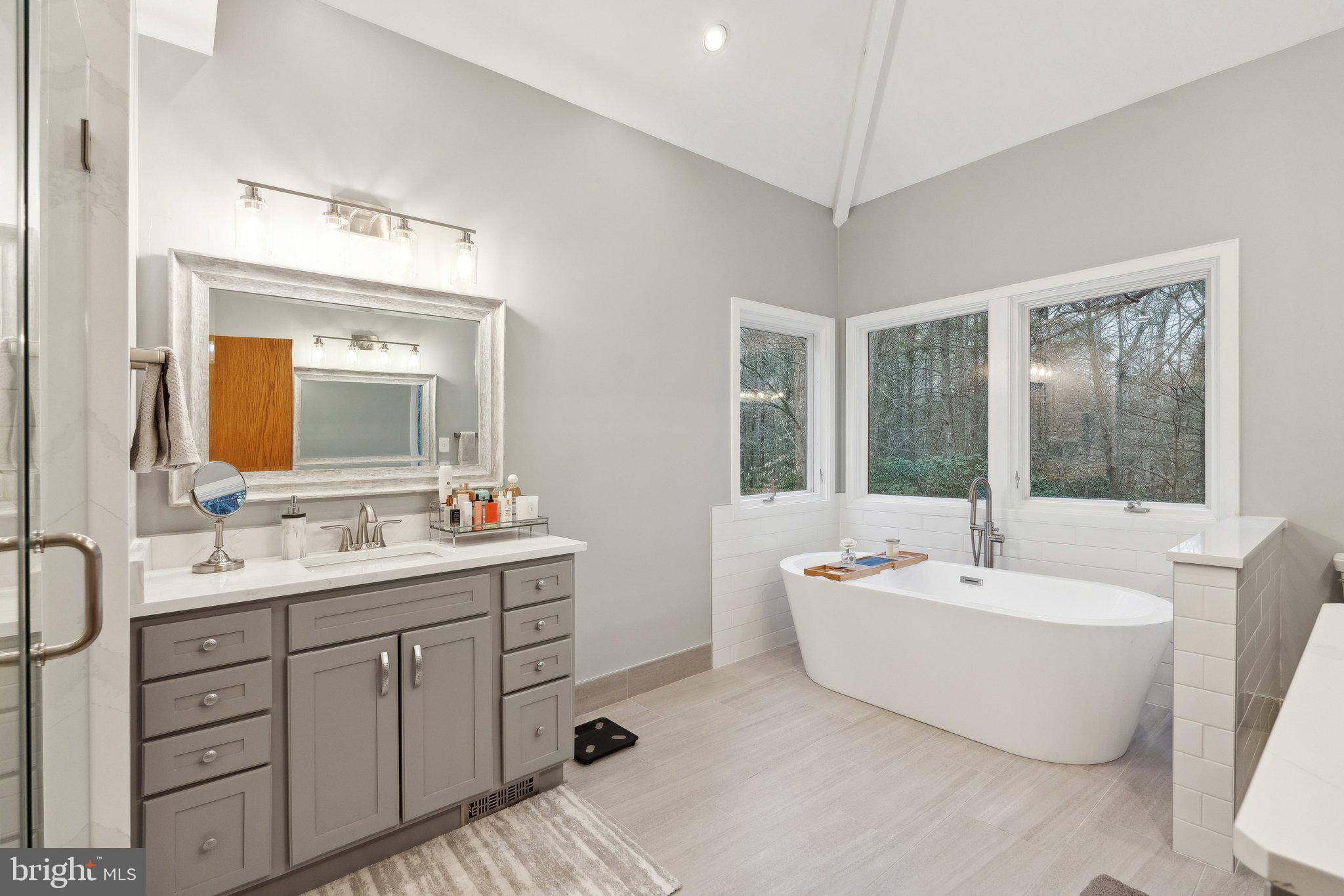 7514 A Evans Ford Road Clifton, VA 20124 - Photo 27 of 50 a bathroom with a double vanity sink mirror and bathtub