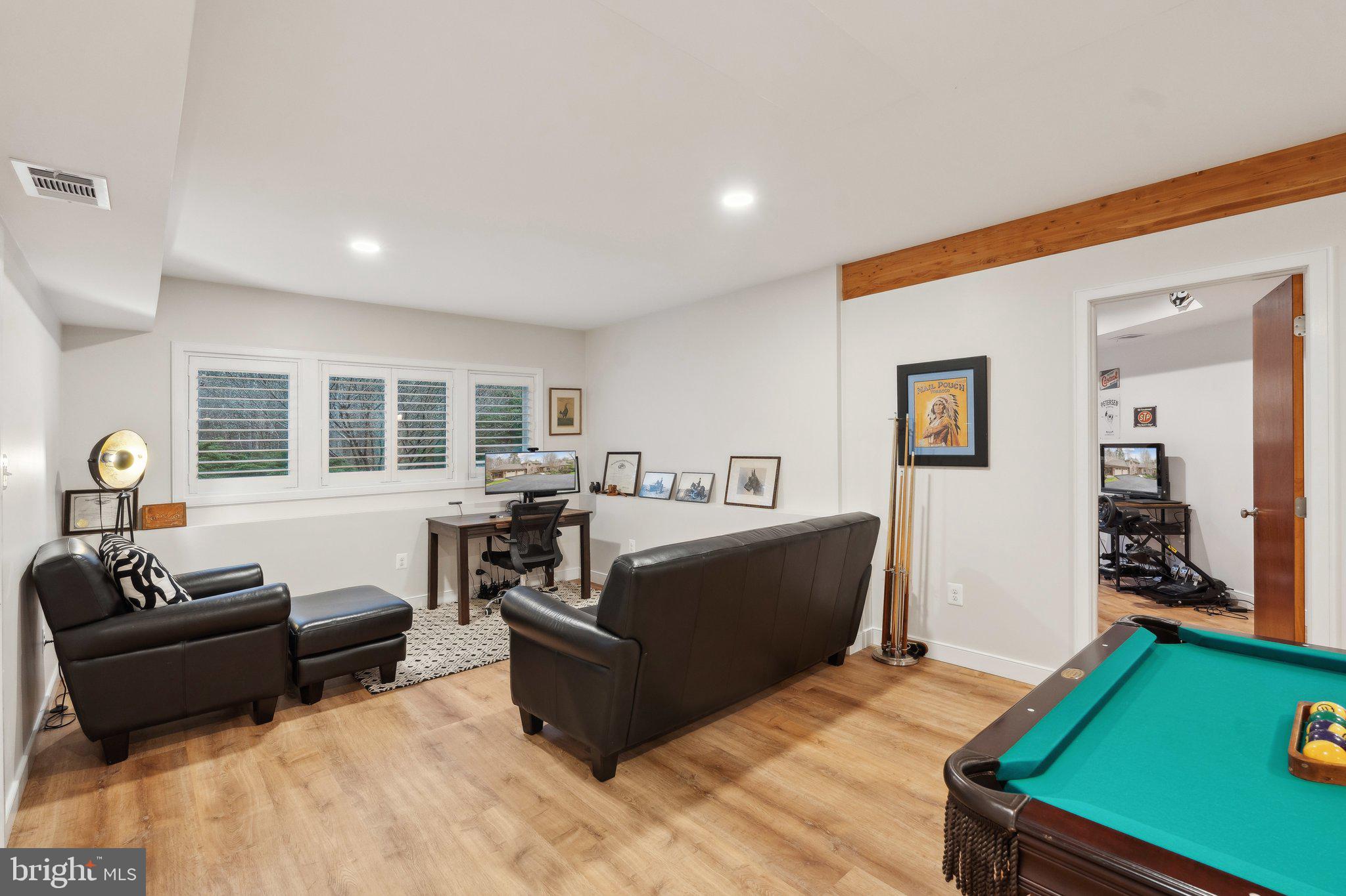 7514 A Evans Ford Road Clifton, VA 20124 - Photo 42 of 50 a living room with furniture and a flat screen tv