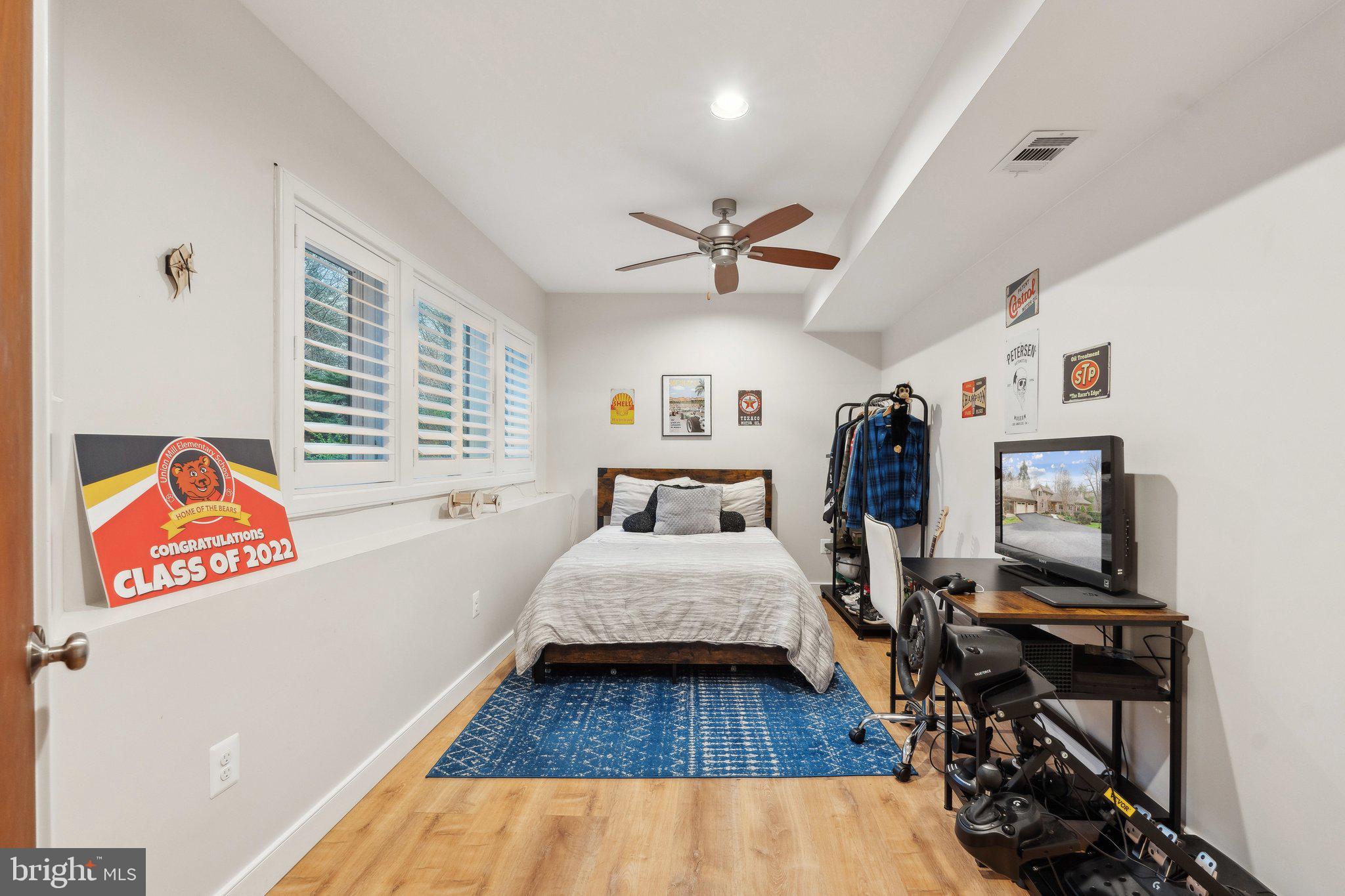 7514 A Evans Ford Road Clifton, VA 20124 - Photo 43 of 50 a bed room with furniture and a flat screen tv