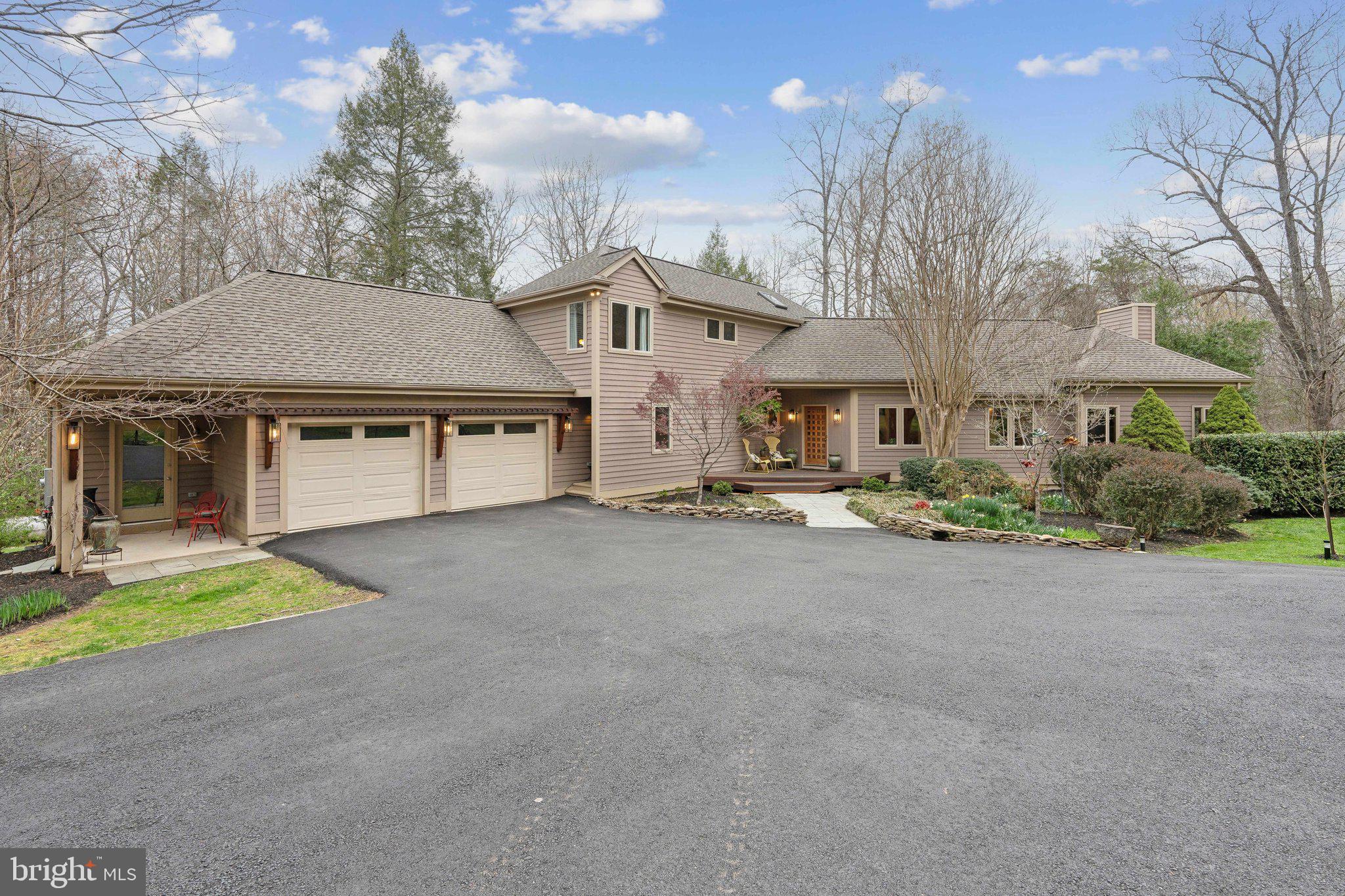 7514 A Evans Ford Road Clifton, VA 20124 - Photo 7 of 50 a front view of a house with a yard and garage
