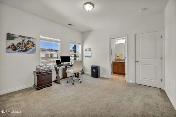 a kitchen with a stove and cabinets