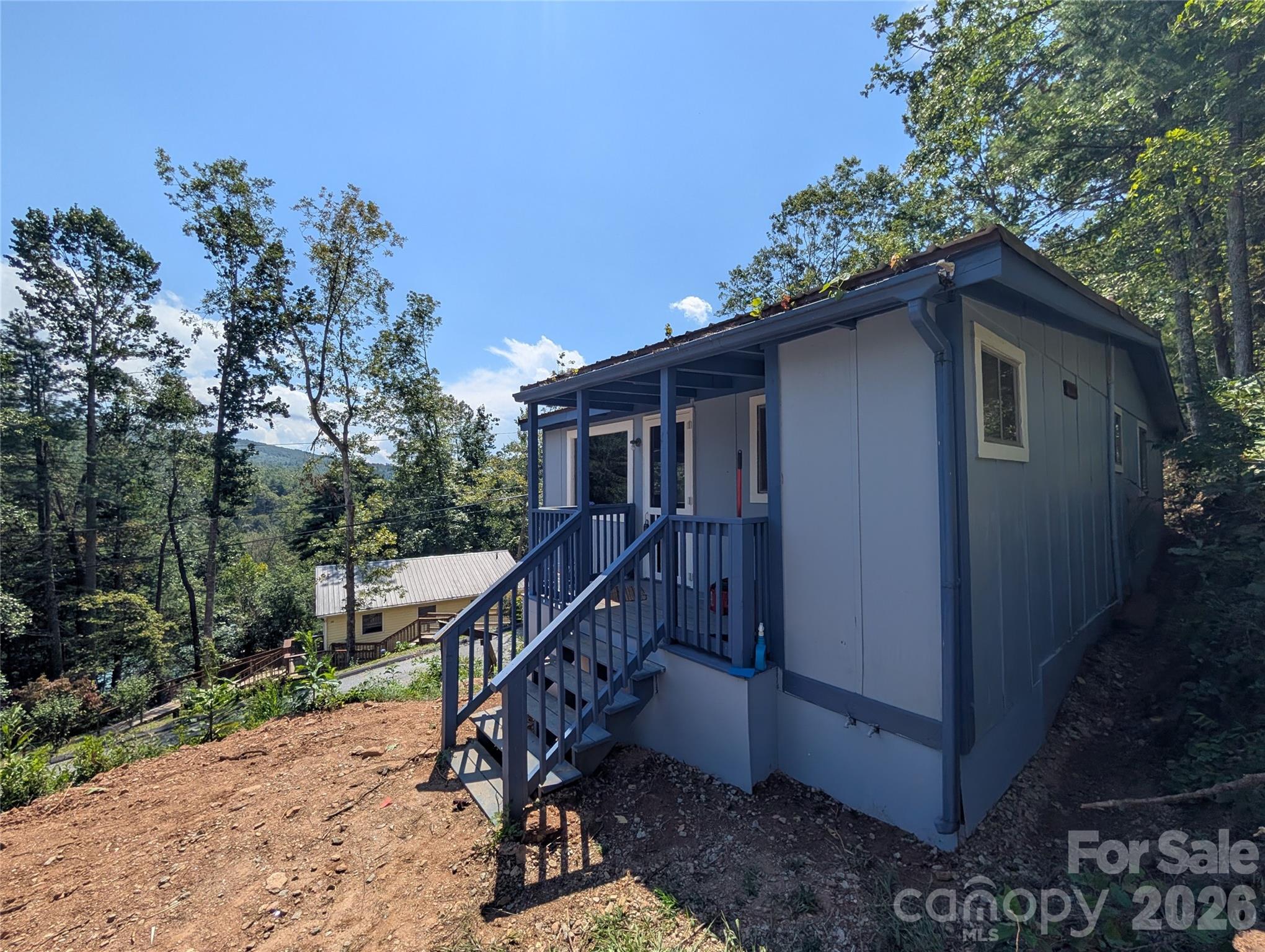 a house with trees in the background