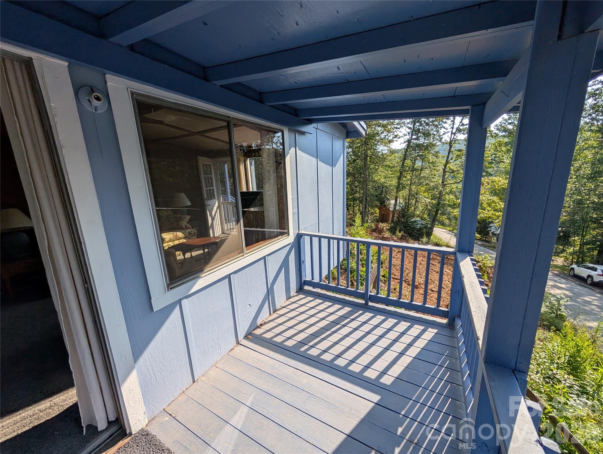 260 Oak Ridge Road Hendersonville, NC 28792 - Photo 11 of 24 a view of a balcony with wooden floor