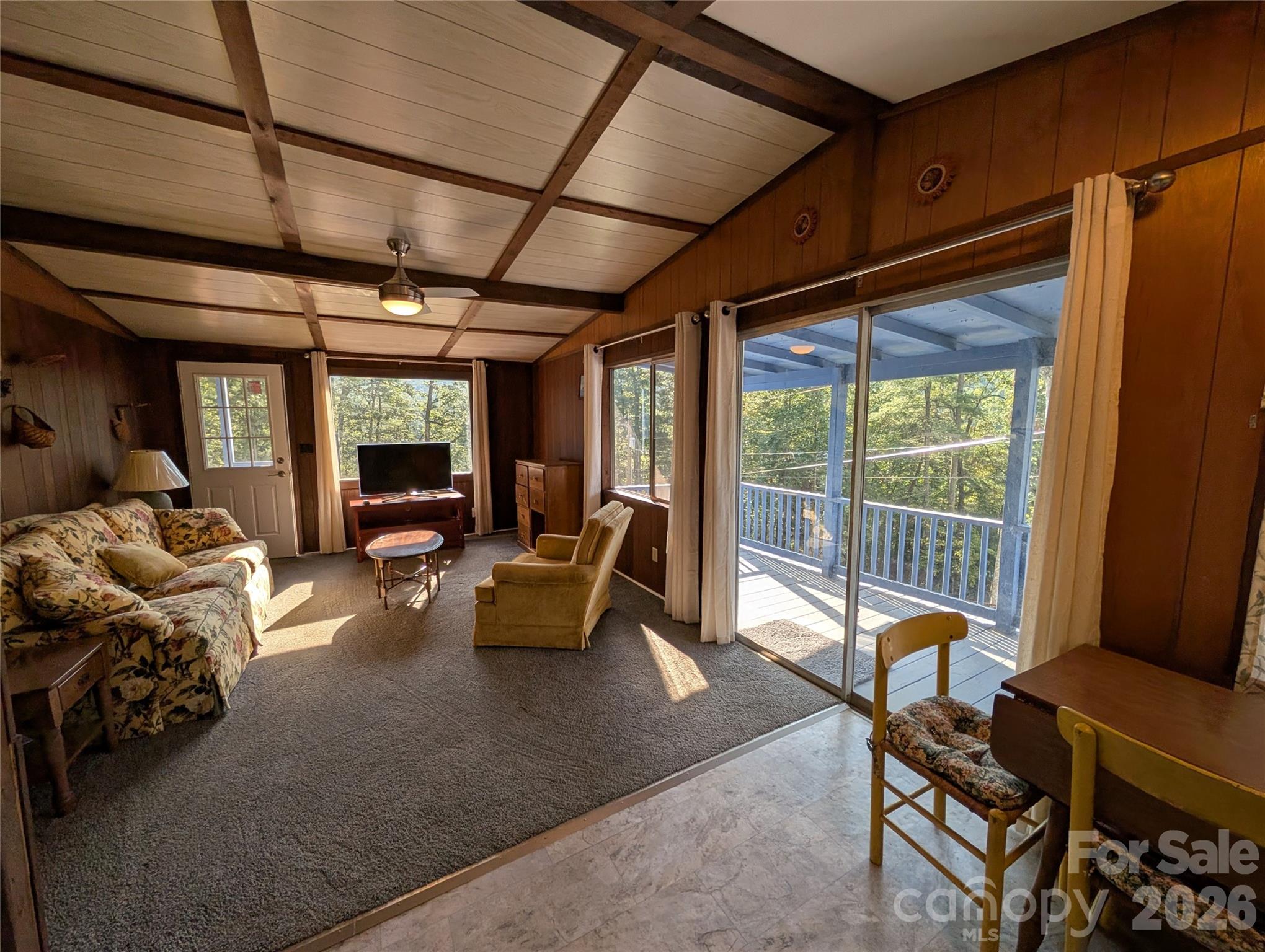 260 Oak Ridge Road Hendersonville, NC 28792 - Photo 14 of 24 a living room with furniture and a flat screen tv