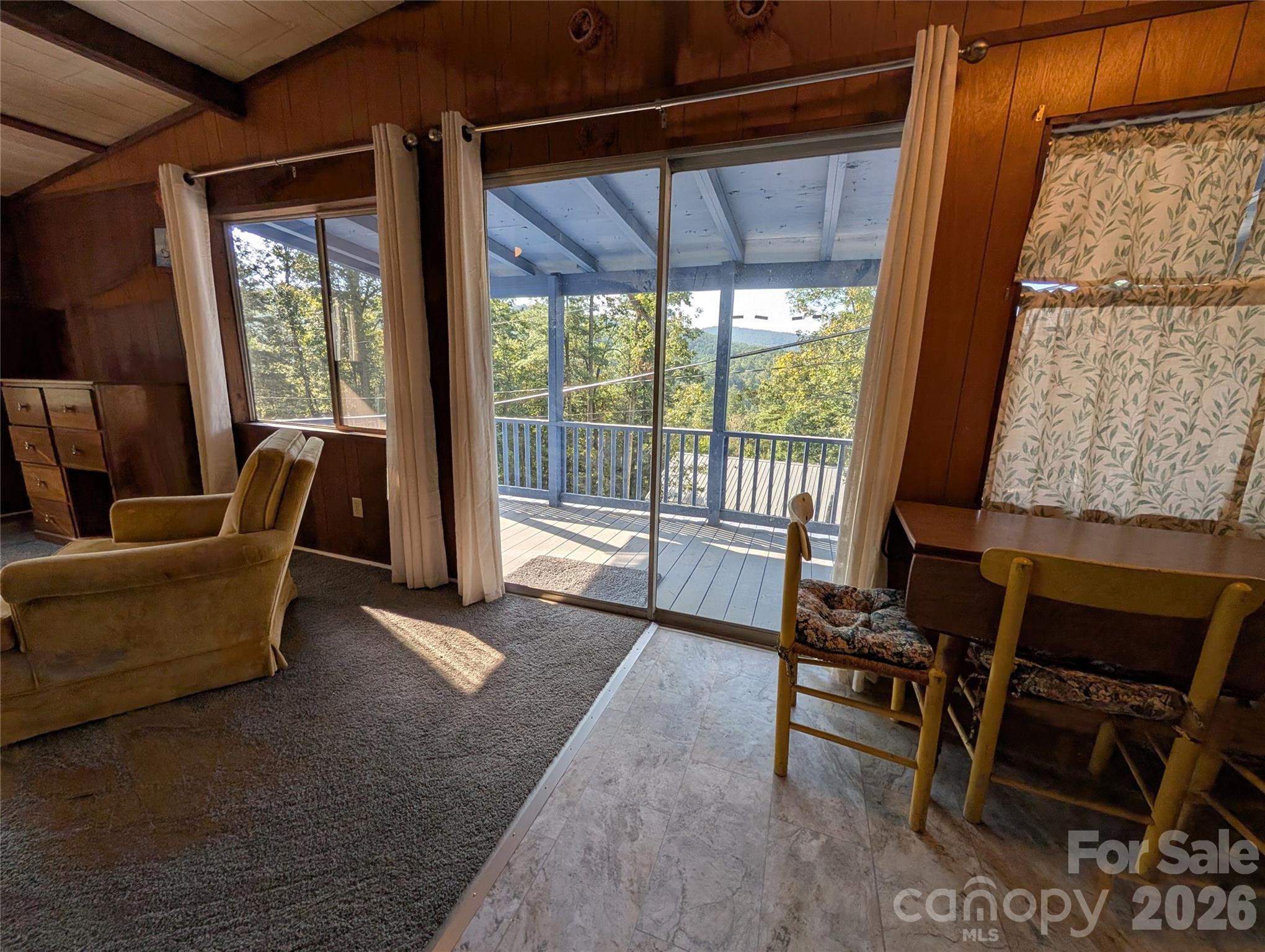 260 Oak Ridge Road Hendersonville, NC 28792 - Photo 15 of 24 a living room with furniture and a floor to ceiling window