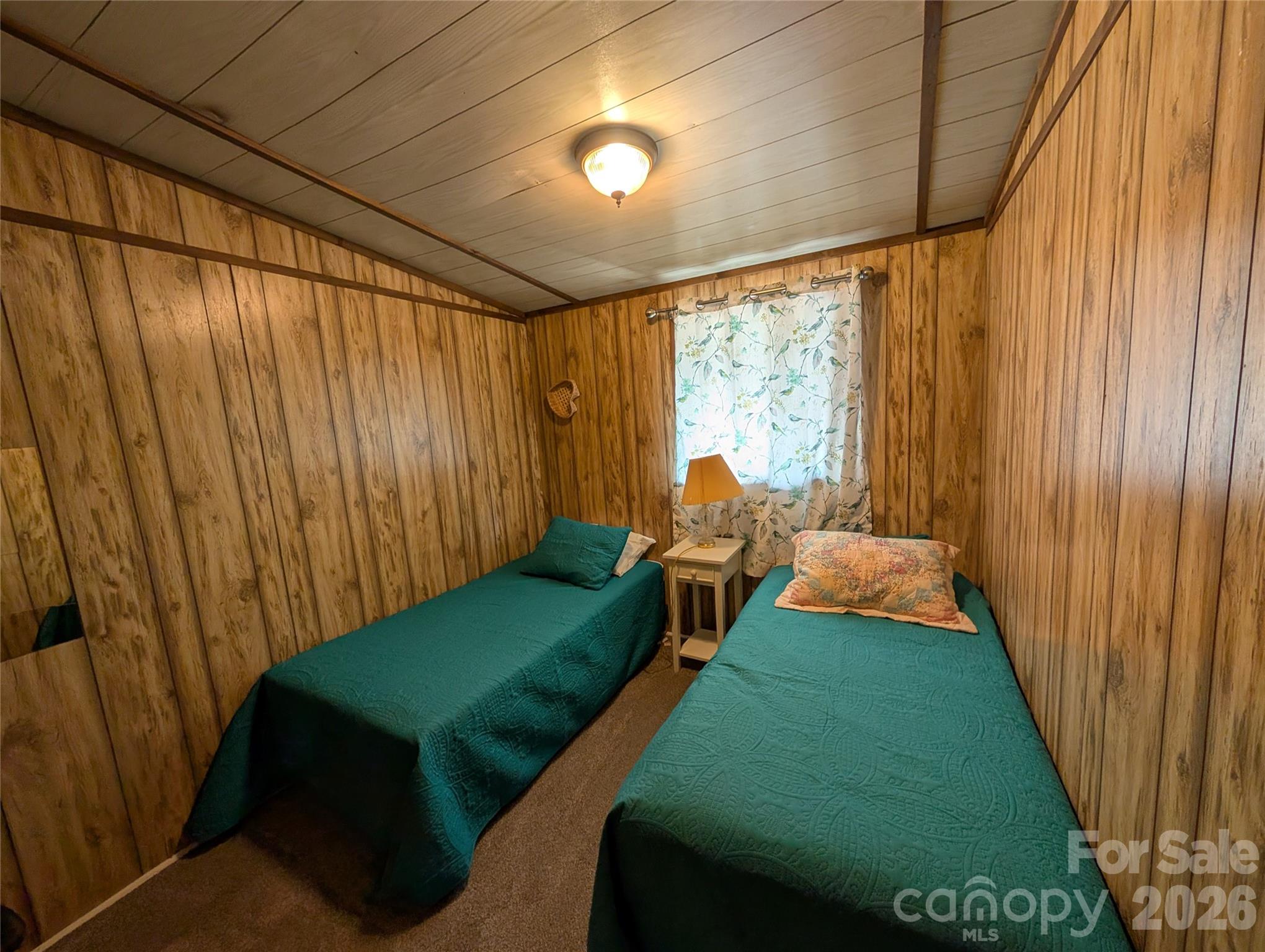 260 Oak Ridge Road Hendersonville, NC 28792 - Photo 19 of 24 a bedroom with furniture and a window