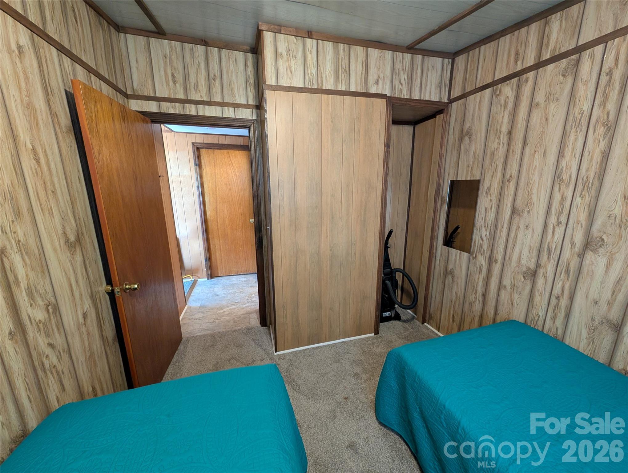 260 Oak Ridge Road Hendersonville, NC 28792 - Photo 20 of 24 a bedroom with a bed and a rug