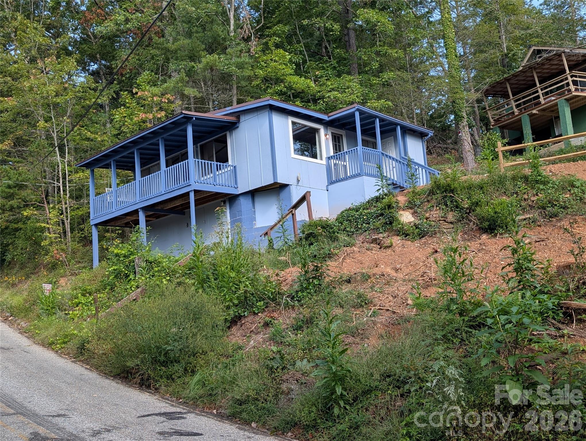 260 Oak Ridge Road Hendersonville, NC 28792 - Photo 24 of 24 a view of a house with roof deck