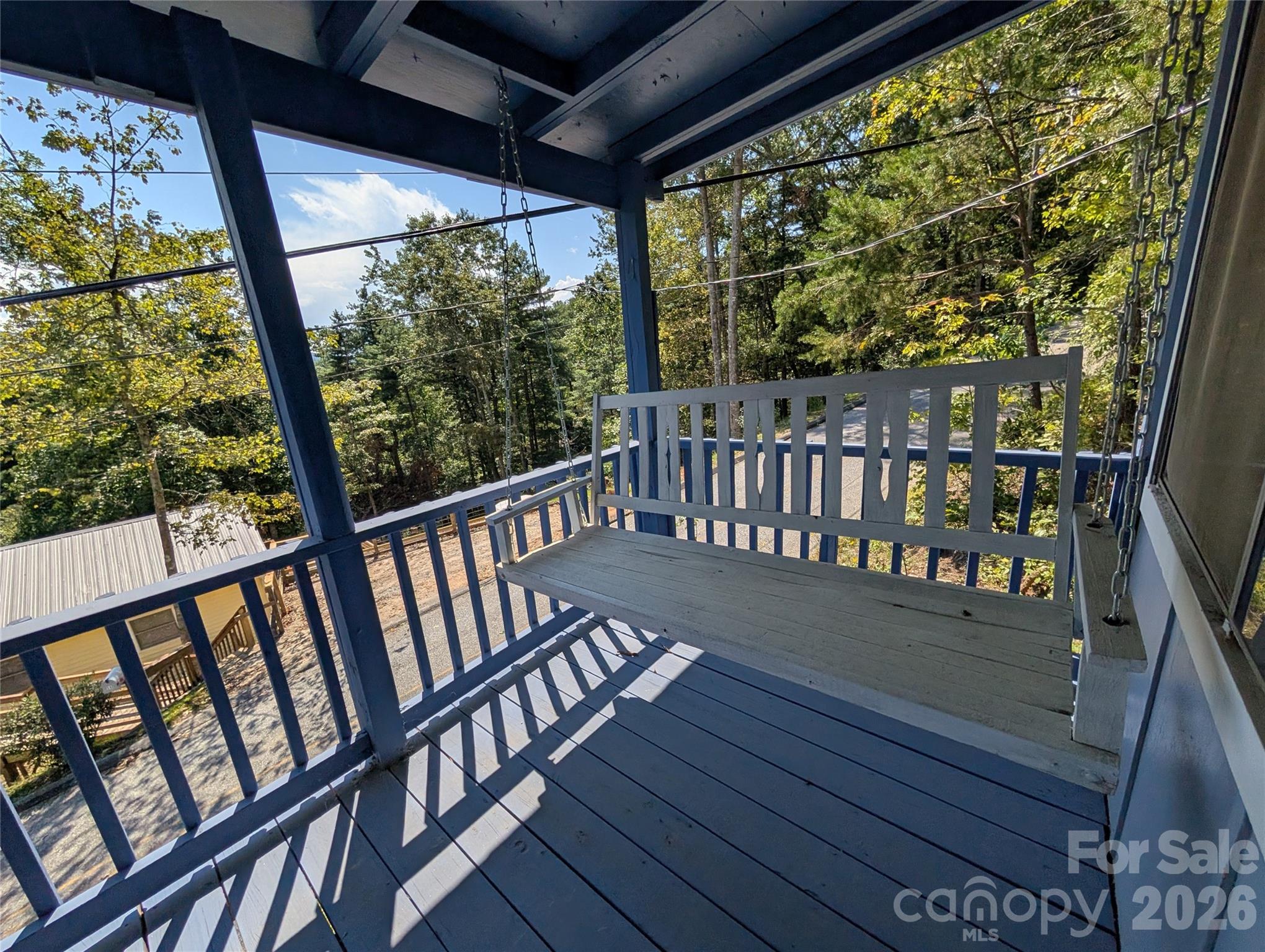 260 Oak Ridge Road Hendersonville, NC 28792 - Photo 5 of 24 a view of a two chair in the balcony