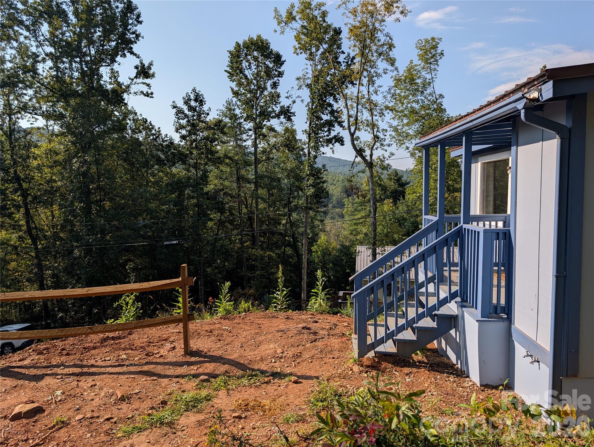 260 Oak Ridge Road Hendersonville, NC 28792 - Photo 7 of 24 a view of deck with a flat tv and a swing