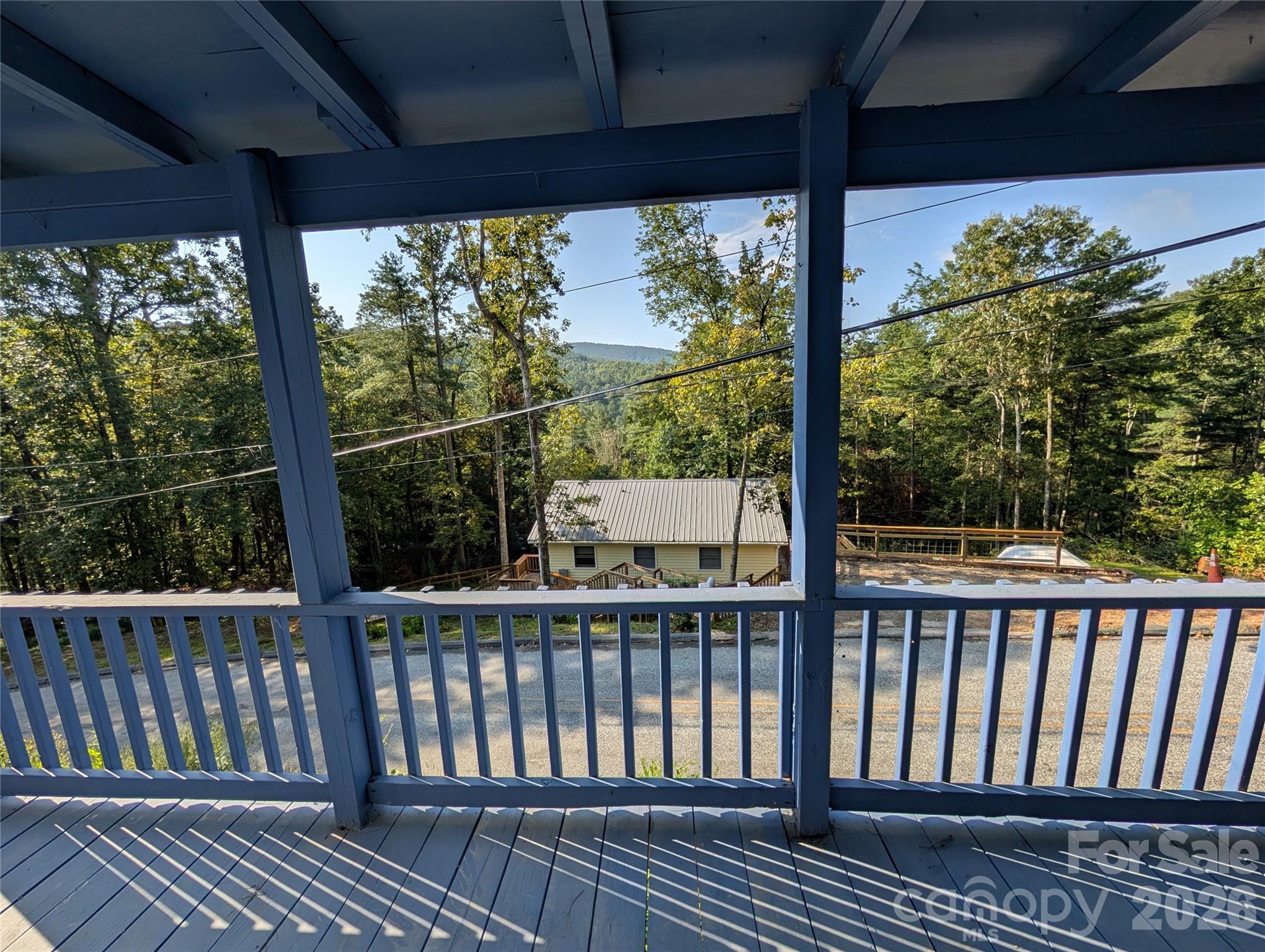 260 Oak Ridge Road Hendersonville, NC 28792 - Photo 9 of 24 a view of a balcony with wooden floor