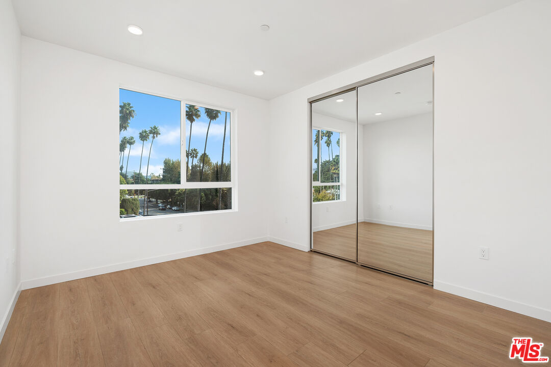 4406 Fulton Avenue, Unit 404 Sherman Oaks, CA 91423 - Photo 17 of 30 a view of an empty room with a window