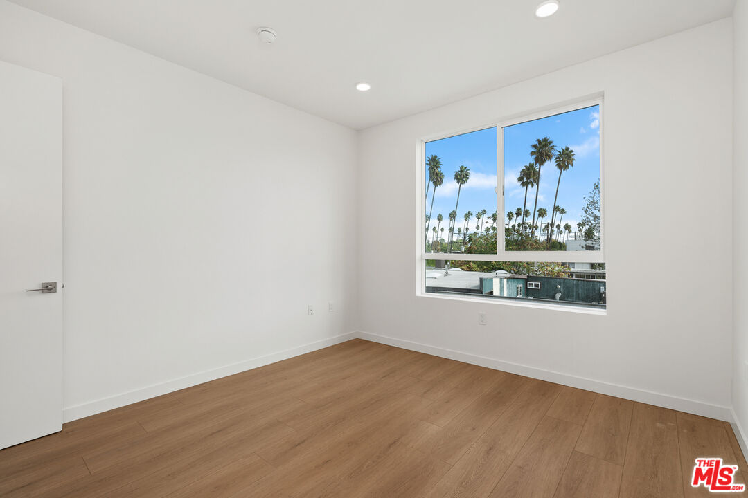 4406 Fulton Avenue, Unit 404 Sherman Oaks, CA 91423 - Photo 19 of 30 an empty room with painting on the wall and wall painting