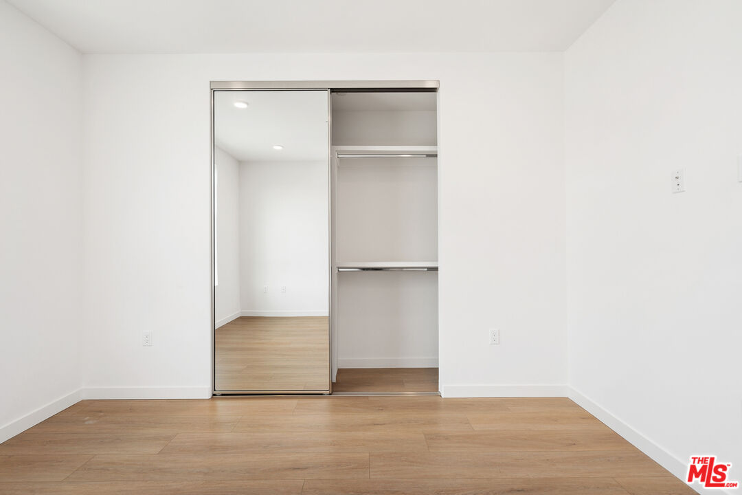 4406 Fulton Avenue, Unit 404 Sherman Oaks, CA 91423 - Photo 20 of 30 a view of an empty room with wooden floor