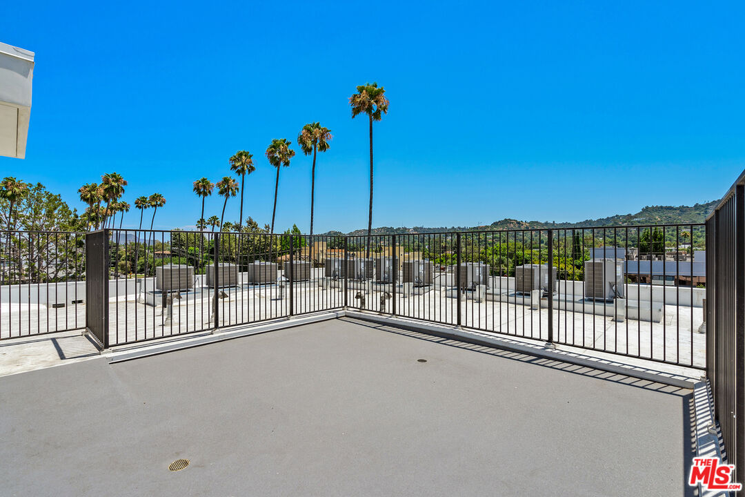 4406 Fulton Avenue, Unit 404 Sherman Oaks, CA 91423 - Photo 21 of 30 a view of a street with a building in the background