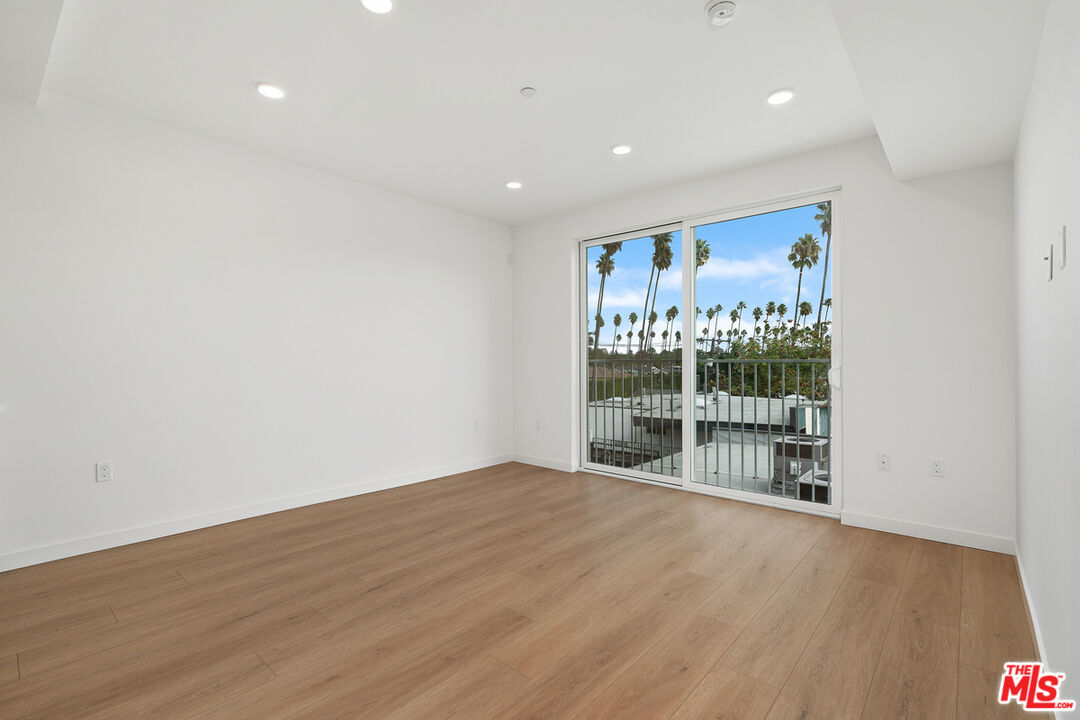 4406 Fulton Avenue, Unit 404 Sherman Oaks, CA 91423 - Photo 7 of 30 a view of empty room with wooden floor