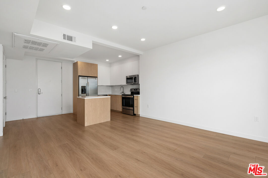 4406 Fulton Avenue, Unit 404 Sherman Oaks, CA 91423 - Photo 10 of 30 a view of kitchen with wooden floor