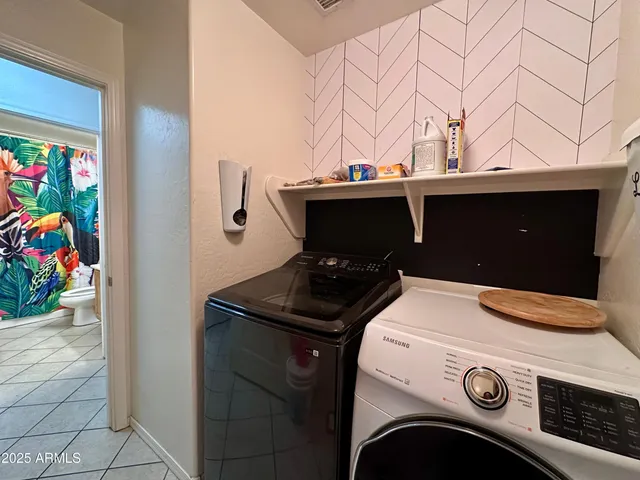 a utility room with dryer and washer