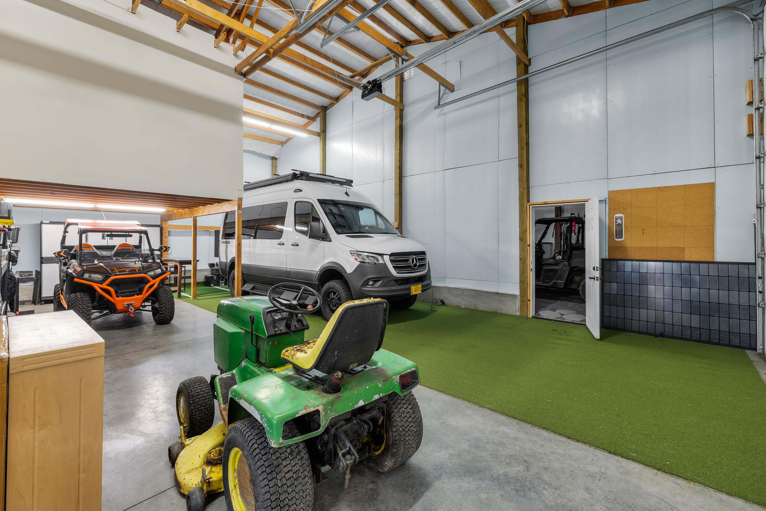 64145 Hunnell Road Bend, OR 97703 - Photo 42 of 65 One of the shop?s large bays offers impressive scale for RV parking, equipment, vehicles or hobby use, with high ceilings, generous clearance and flexible workspace.