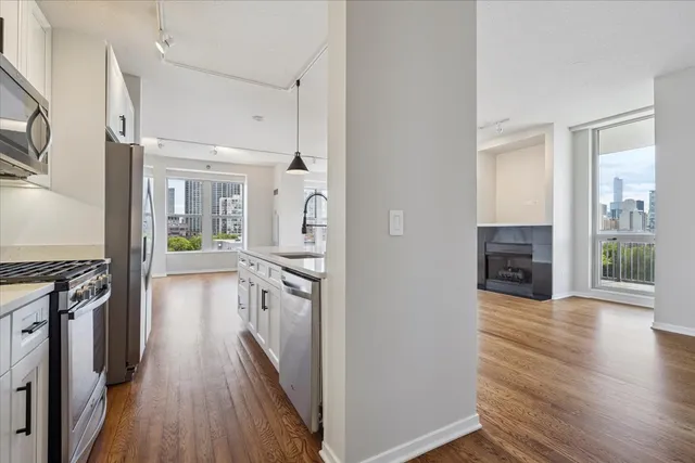 a view of a kitchen cabinets and wooden floor