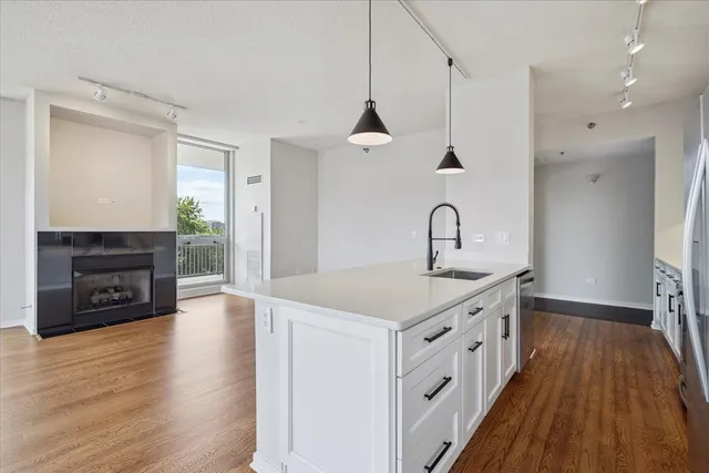 a kitchen with a sink and a stove top oven
