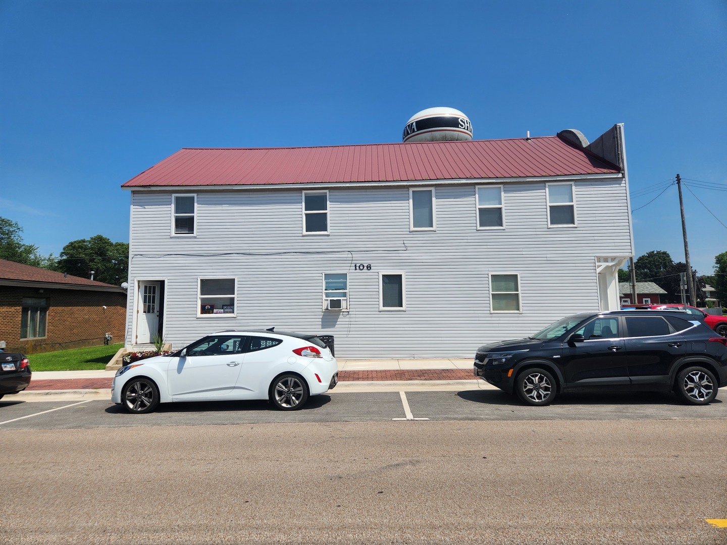 106 West Comanche Avenue, Unit 2W Shabbona, IL 60550 - Photo 1 of 11 a view of a car parked in front of a house
