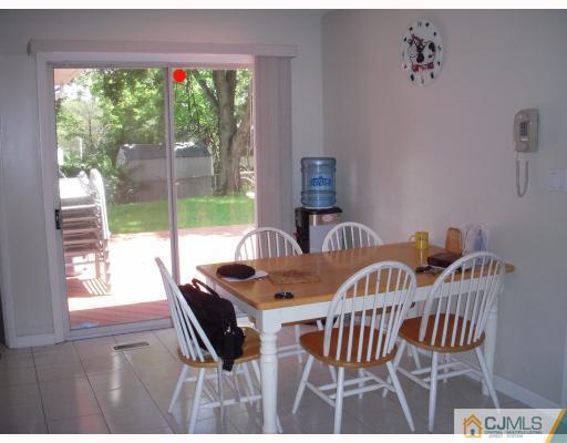 128 Drake Road Somerset, NJ 08873 - Photo 3 of 10 a view of a dining room with furniture wooden floor and a potted plant