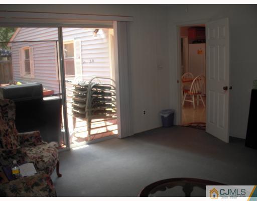 128 Drake Road Somerset, NJ 08873 - Photo 5 of 10 a view of empty room with floor to ceiling window