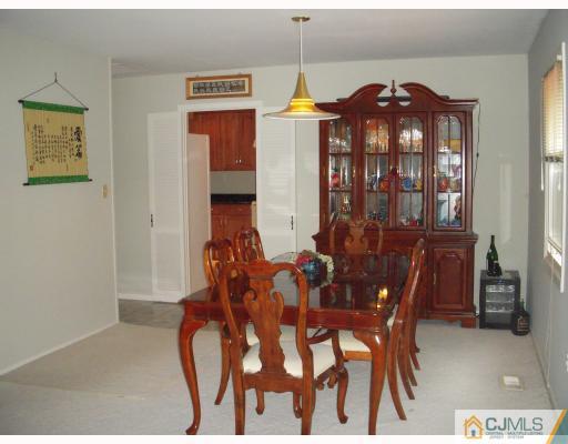 128 Drake Road Somerset, NJ 08873 - Photo 7 of 10 a view of a dining room with furniture and chandelier