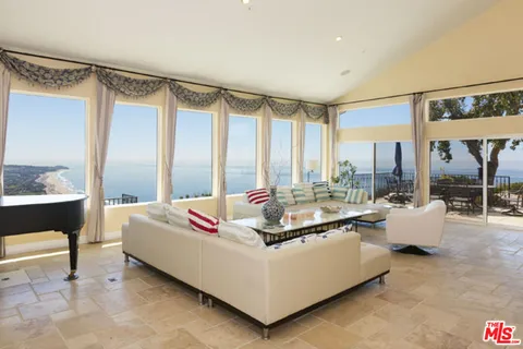 a view of a backyard with furniture