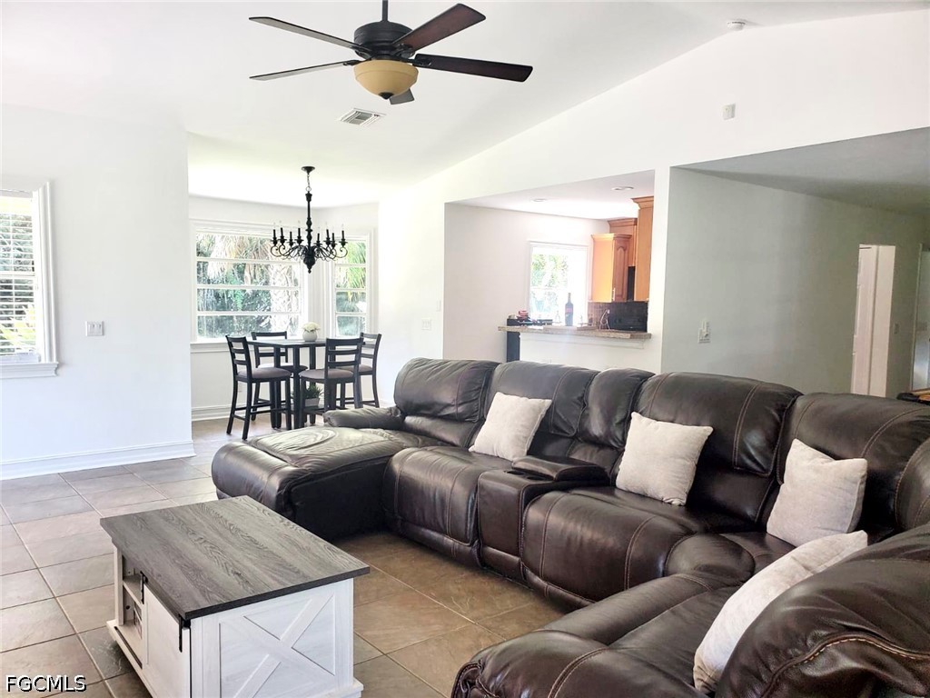 740 19th Street Southwest Naples, FL 34117 - Photo 12 of 35 a living room with furniture and a large window