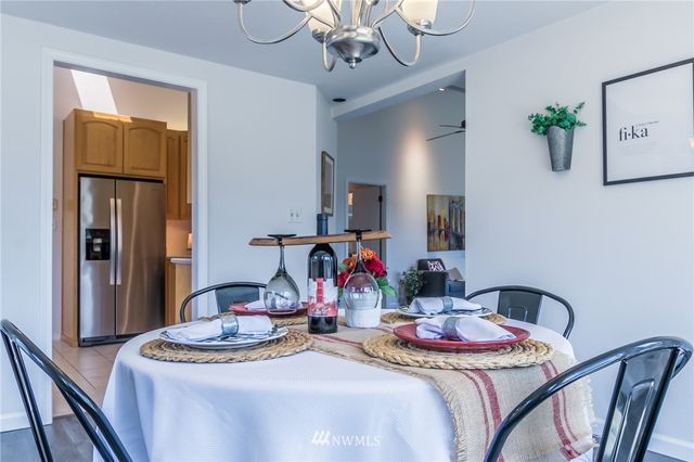 a dining room with furniture and wooden floor