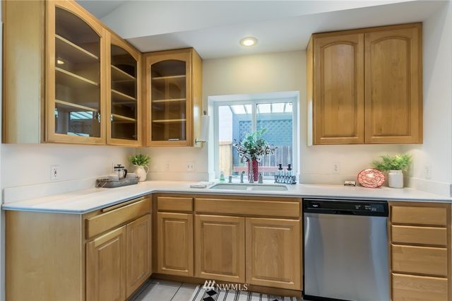a kitchen with a sink and cabinets