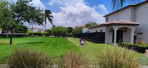 a view of a house with a yard