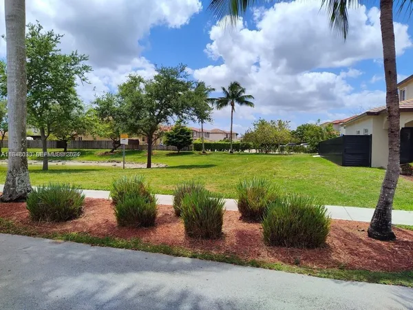 a view of a garden with a fountain