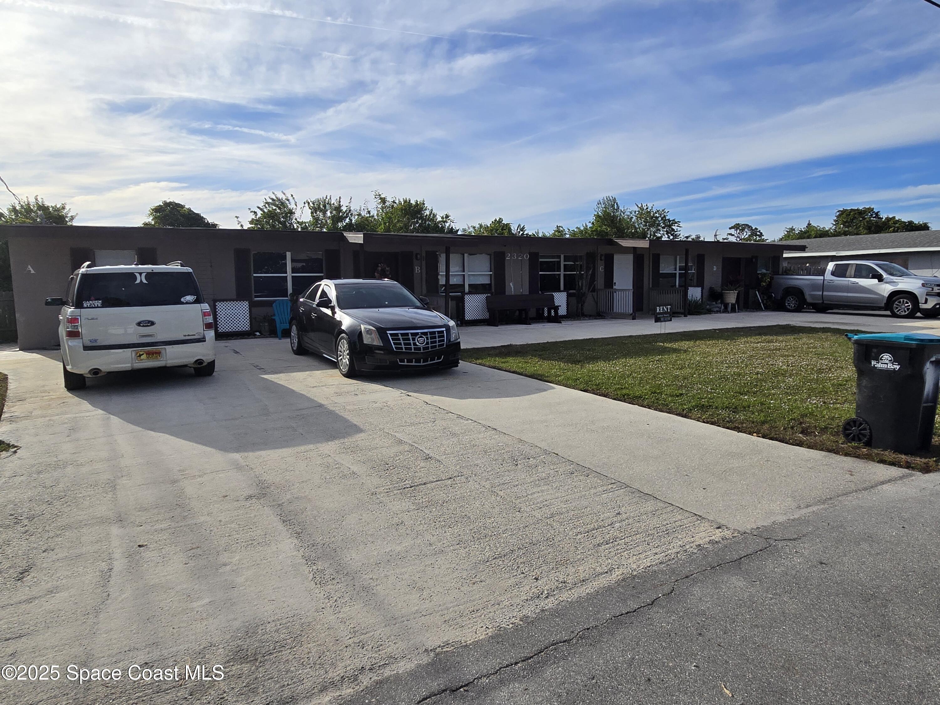 2320 Shenandoah Road, Unit A Palm Bay, FL 32905 - Photo 2 of 11 a house view with a garden space