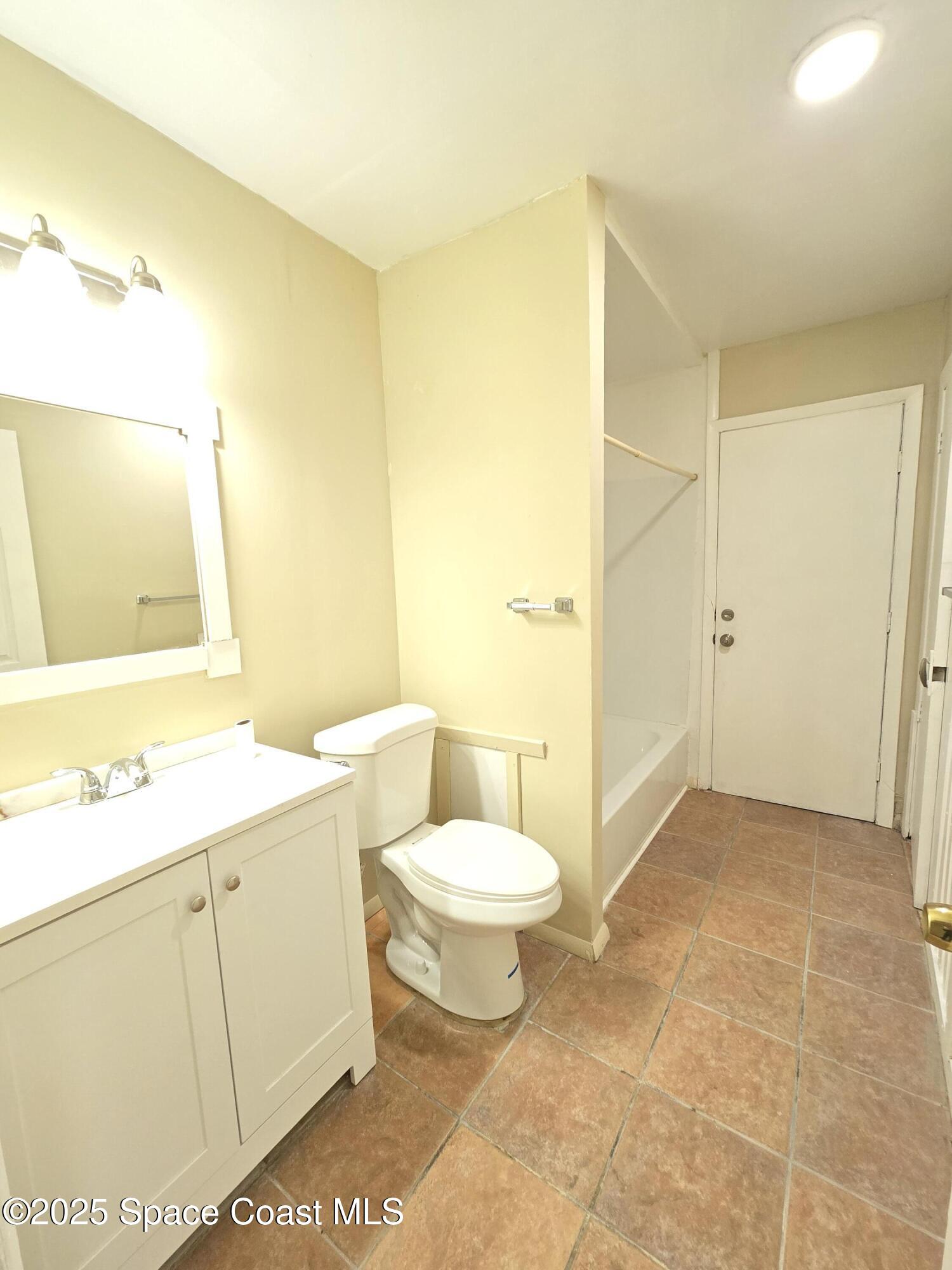 2320 Shenandoah Road, Unit A Palm Bay, FL 32905 - Photo 6 of 11 a bathroom with a sink toilet and shower