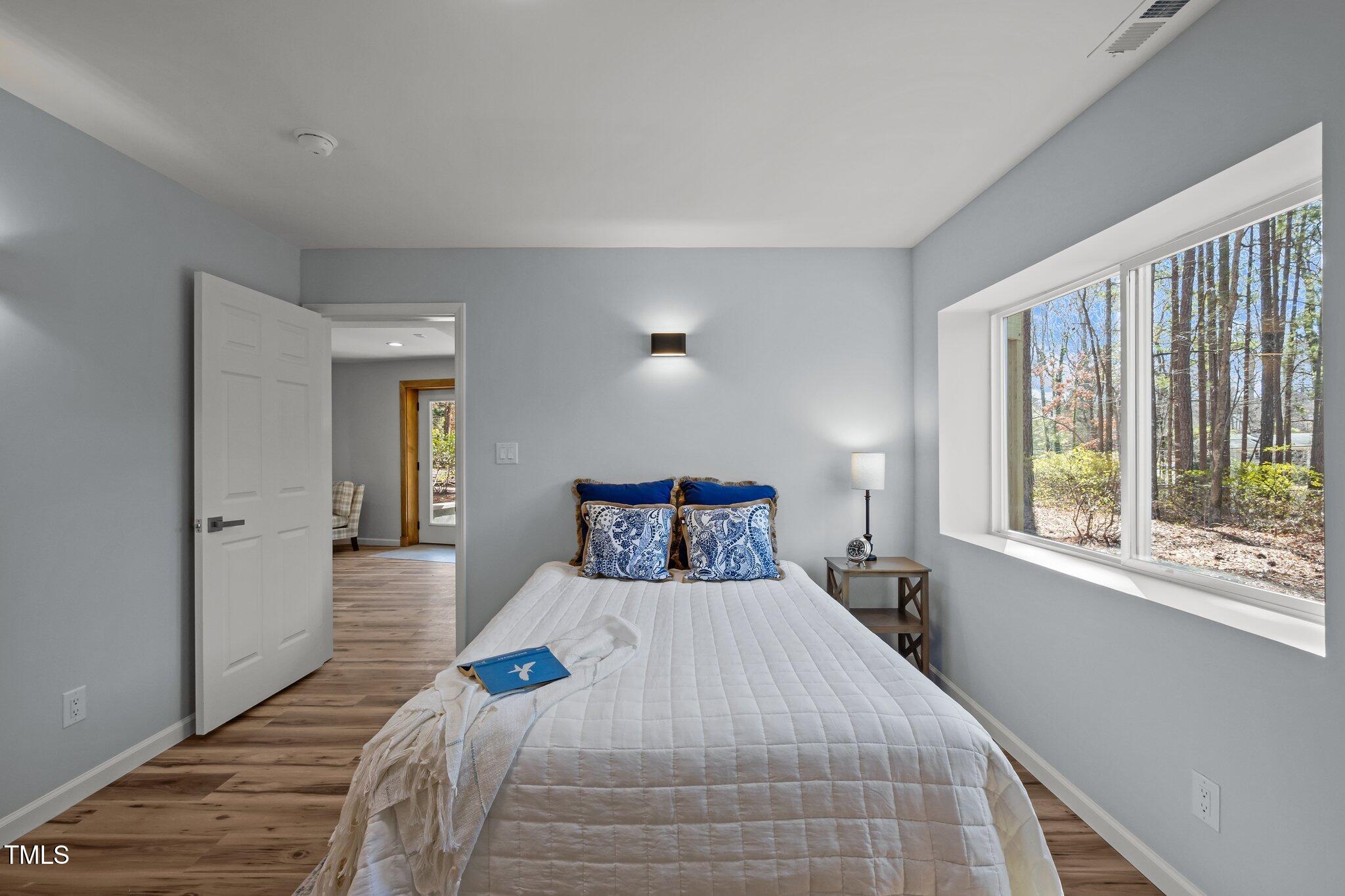 419 Obie Drive Durham, NC 27713 - Photo 14 of 33 a bedroom with a bed and a large window