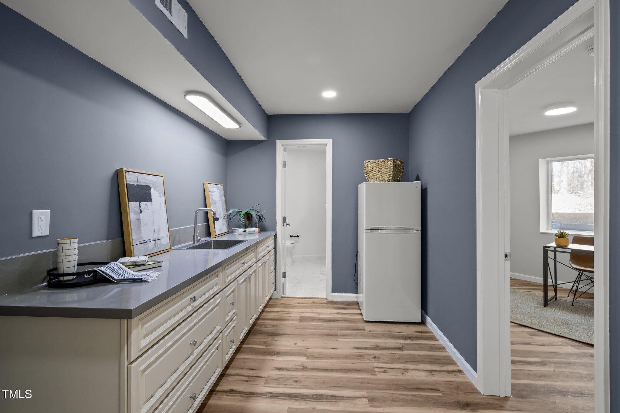 419 Obie Drive Durham, NC 27713 - Photo 15 of 33 a kitchen with a sink and refrigerator