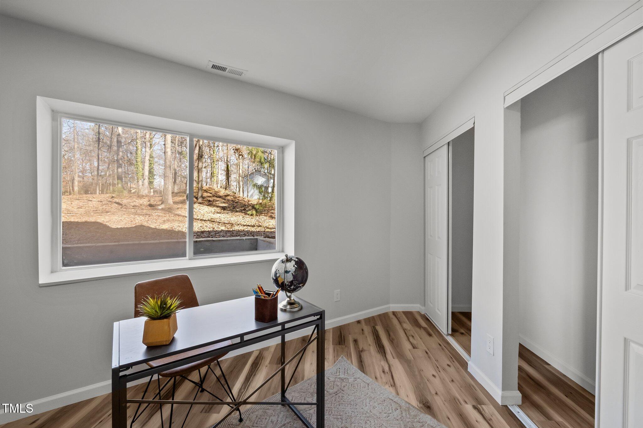 419 Obie Drive Durham, NC 27713 - Photo 16 of 33 a bedroom with furniture and a window