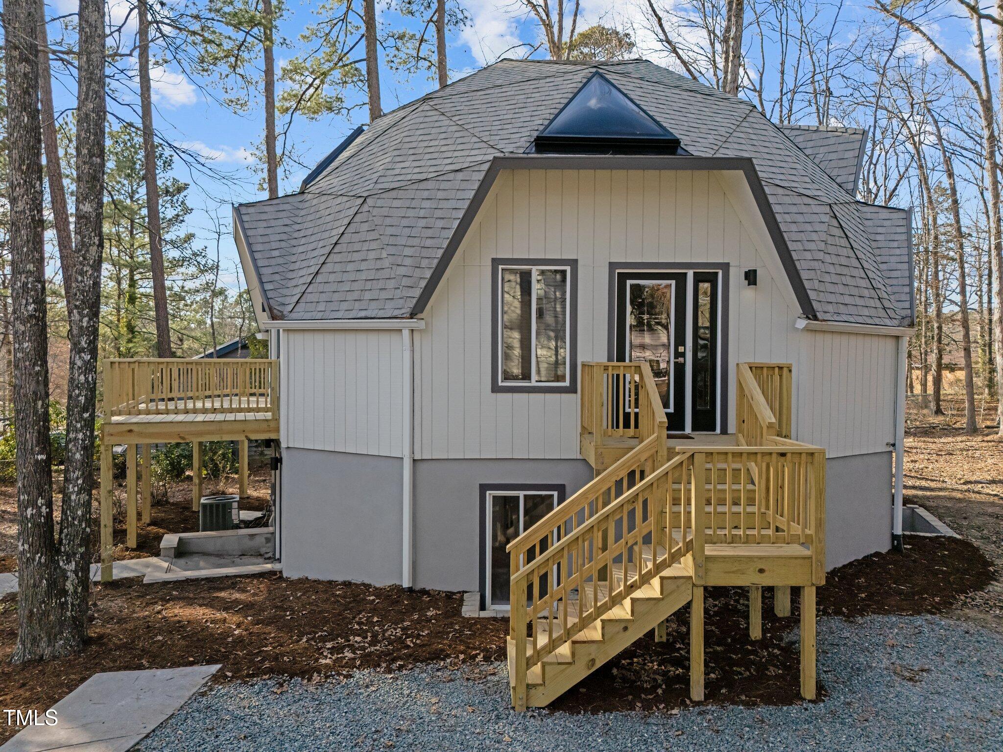 419 Obie Drive Durham, NC 27713 - Photo 23 of 33 a roof deck with table and chairs and potted plants