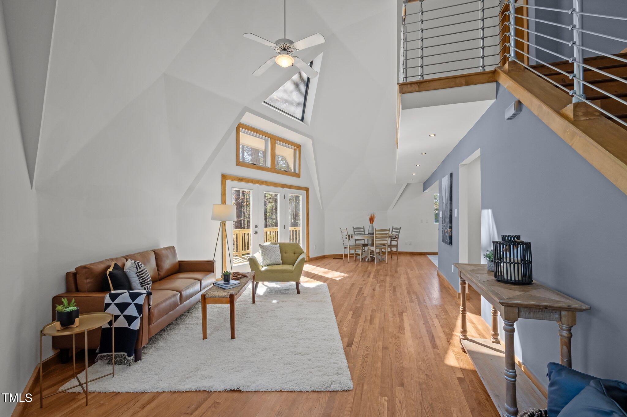 419 Obie Drive Durham, NC 27713 - Photo 4 of 33 a living room with furniture and a wooden floor