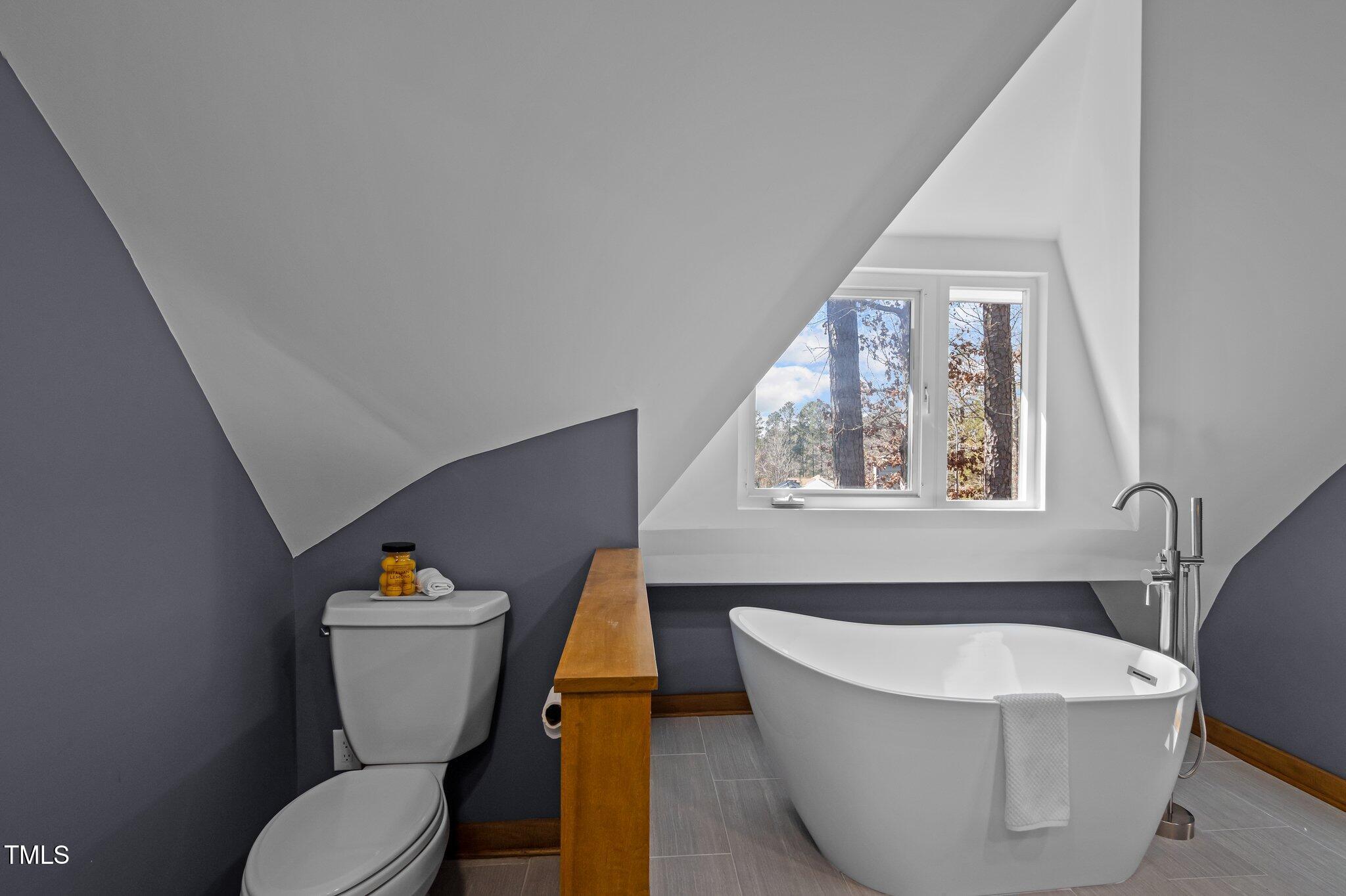 419 Obie Drive Durham, NC 27713 - Photo 8 of 33 a living room with a couch and a window