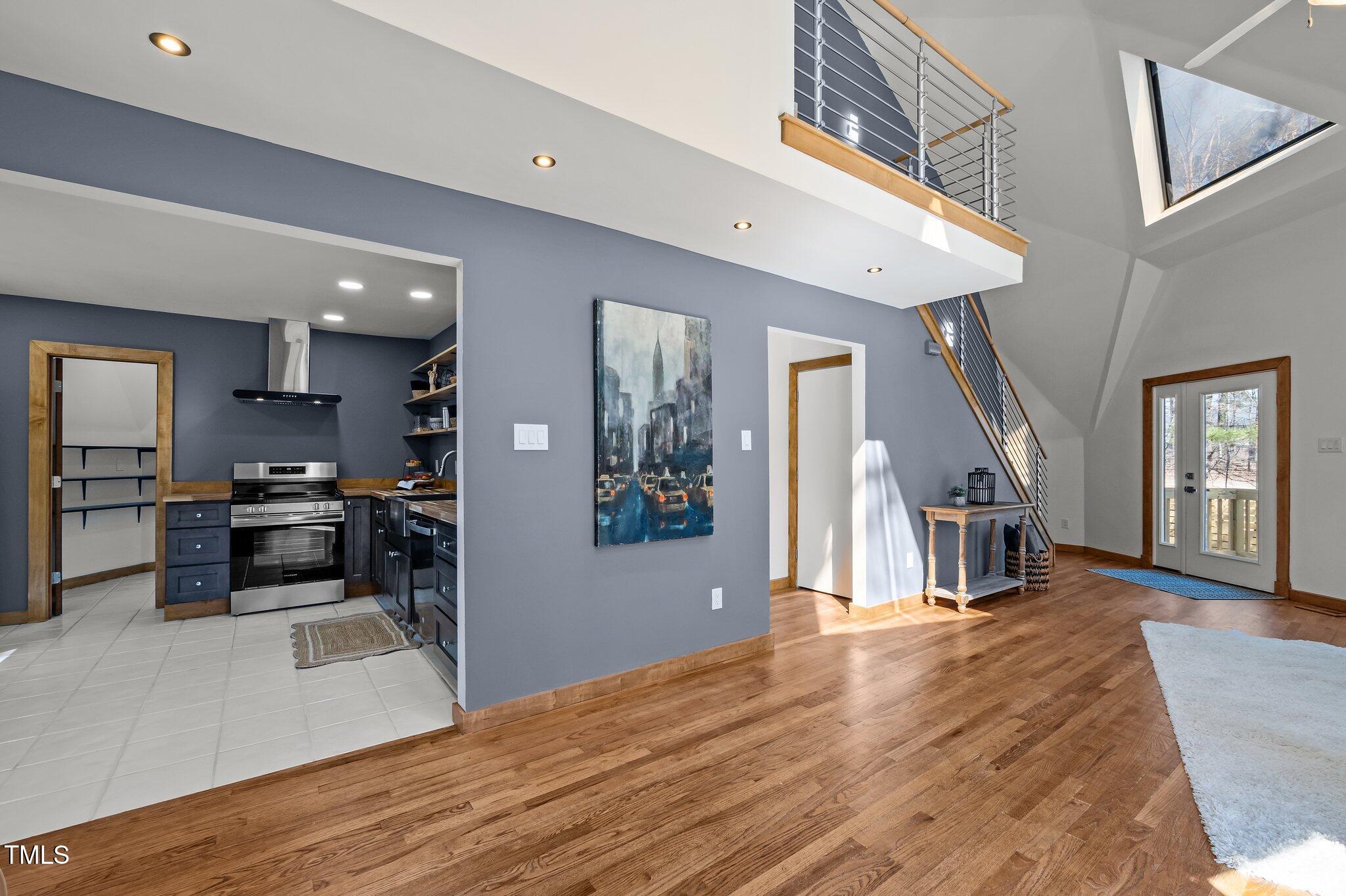 419 Obie Drive Durham, NC 27713 - Photo 9 of 33 a view of a kitchen with furniture and wooden floor