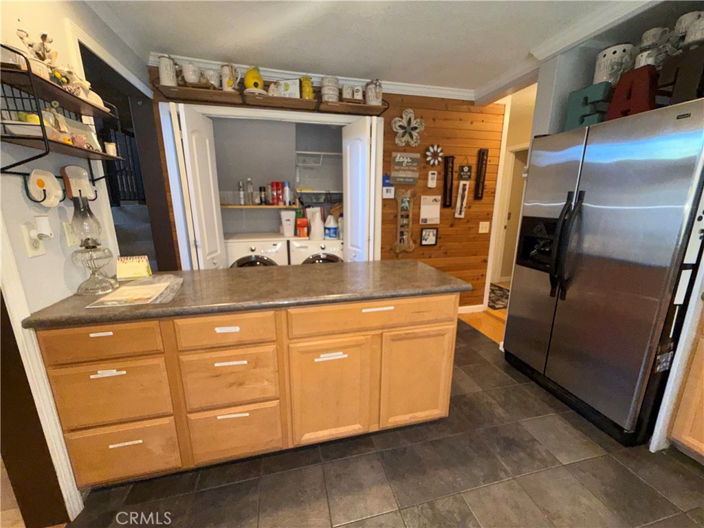 9312 Mountain Meadow Road Shingletown, CA 96088 - Photo 26 of 44 a kitchen with stainless steel appliances granite countertop a refrigerator and a sink